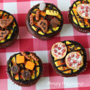 BBQ Grill Cupcakes decorated with modeling chocolate burgers, hot dogs, corn, pizza, and more.