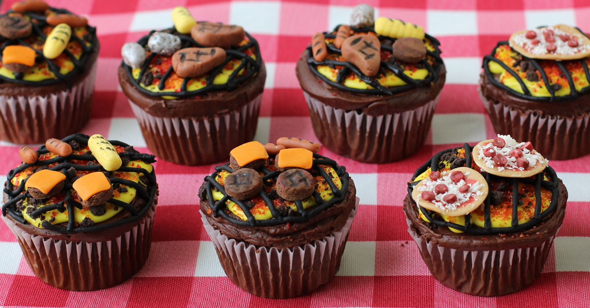 BBQ Grill Cupcakes topped with hamburgers, hot dogs, baked potatoes, corn, and pizzas. 